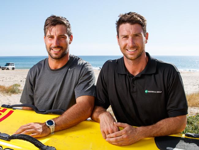 Surf lifesavers Tom and Michael Knauer who rescued a mother and daughter 350 metres offshore with their paddle-boards yesterday at Moana Beach. Picture Matt Turner.