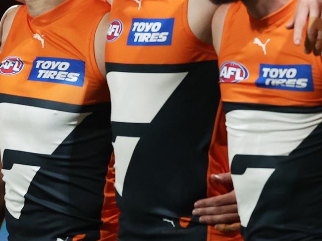 SYDNEY, AUSTRALIA - SEPTEMBER 14:  The Giants line up for the welcome to country and national anthem ceremony during the AFL First Semi Final match between GWS Giants and Brisbane Lions at ENGIE Stadium, on September 14, 2024, in Sydney, Australia. (Photo by Matt King/AFL Photos/via Getty Images)