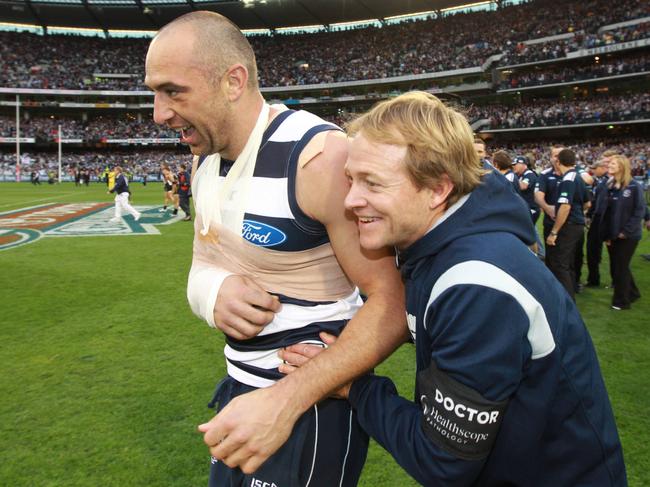 Geoff Allen with James Podiadly after the 2011 grand final.