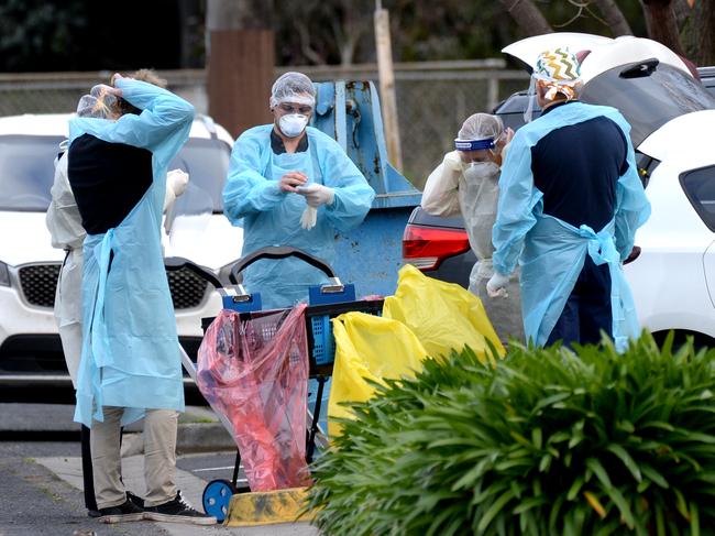 People don PPE outside Doutta Galla Aged Services at Yarraville, in Melbourne's inner west. Picture: Andrew Henshaw