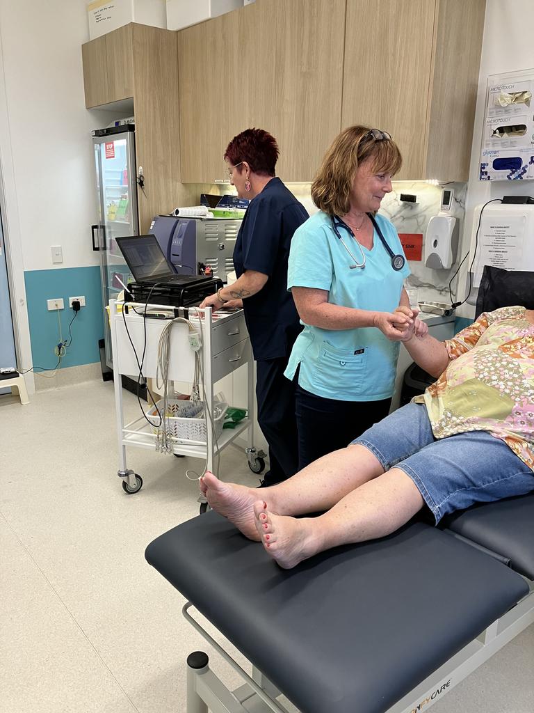 Mount Louisa Medical Centre registered nurse Anita Fowler assists Dr Paula Heggarty with treating a patient. Picture: Supplied.
