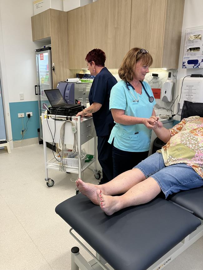 Mount Louisa Medical Centre registered nurse Anita Fowler assists Dr Paula Heggarty with treating a patient. Picture: Supplied.