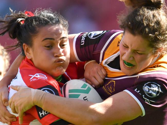 Annette Brander (left) of the Dragons is tackled by Chelsea Lenarduzzi (right) of the Broncos during the NRL Women's Premiership match between the Brisbane Broncos and the St George-Illawarra Dragons at Suncorp Stadium in Brisbane, Sunday, September 9, 2018. (AAP Image/Darren England) NO ARCHIVING, EDITORIAL USE ONLY