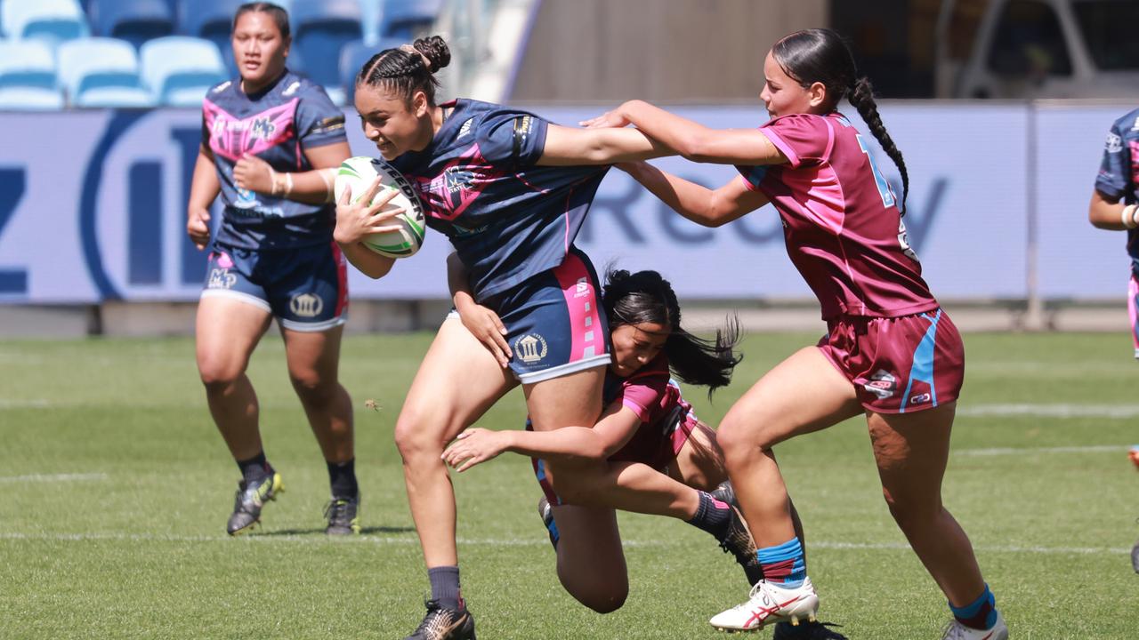 Kiarah Siauane playing for Mabel Park SHS in last year’s final - Malaela Su’a is in the background. Photo: Tim Pascoe