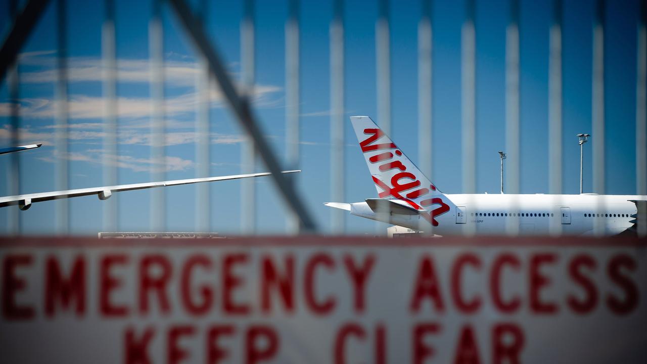 Virgin Australia aircraft parked on the tarmac at Brisbane Airport. Picture: Patrick Hamilton/AFP