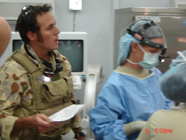 Medic Brad Watts inside the military field hospital at Tarin Kowt