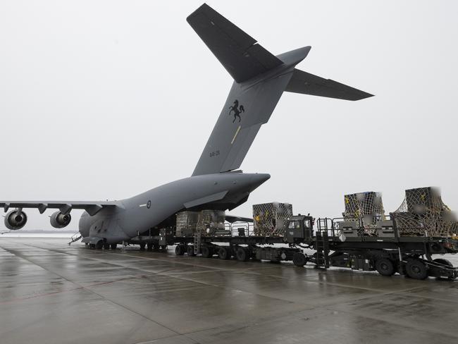 A Royal Australian Air Force C-17A Globemaster III aircraft delivers defensive military assistance into Europe in support of the Ukrainian Government. Digitally altered for operational security reasons.