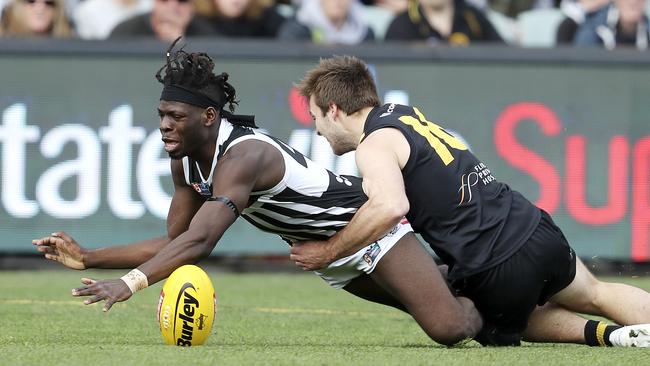 Martin Frederick gets brought down by Cory Gregson in the SANFL grand final. Picture SARAH REED