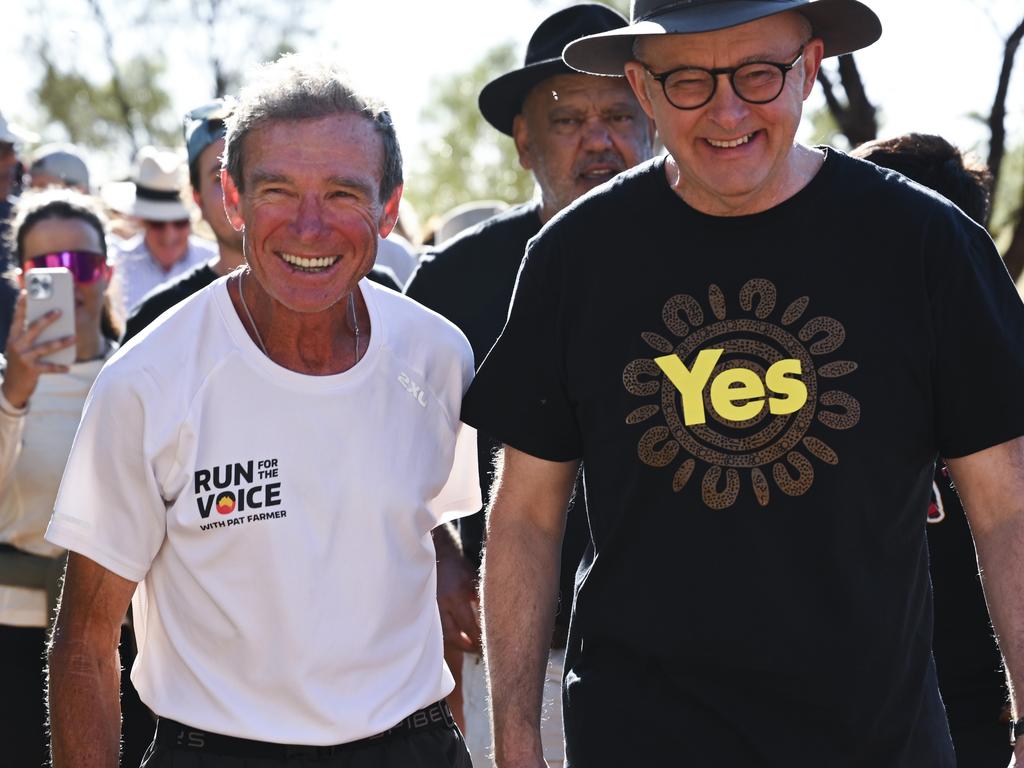 Mr Albanese with Pat Farmer as he finishes his run around the country to raise awareness about the Yes campaign in Uluru. Picture: NCA NewsWire / Martin Ollman