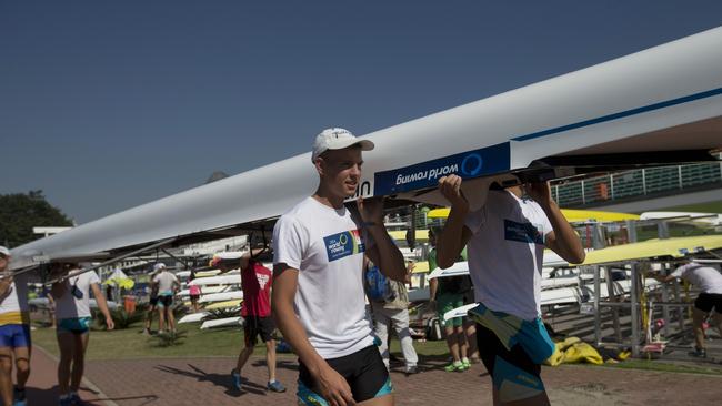 Rowers from the Ukraine carry their boat during the World Junior Rowing Championships.