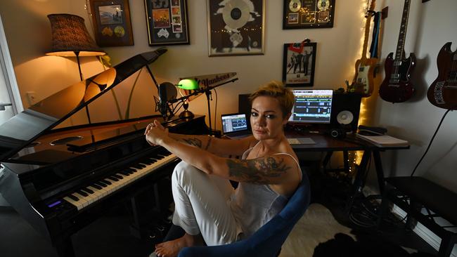 Singer-songwriter Sarah McLeod at her home studio in Teneriffe, Brisbane, where she recorded a cover of the Cold Chisel classic Flame Trees. Picture: Lyndon Mechielsen