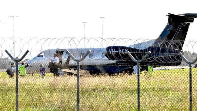 Premier Steven Miles and staff exit a private jet at the Government Air Wing at Brisbane Airport last week. Picture: Lyndon Mechielsen