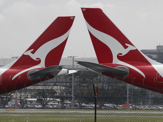 SYDNEY, AUSTRALIA - NewsWire Photos February 25, 2021: QANTAS has reported losses of around 1 billion dollars over the last year, counting the financial cost of Covid-19 on the airline. QANTAS planes are pictured at Sydney Airport today. Picture: NCA NewsWire / David Swift