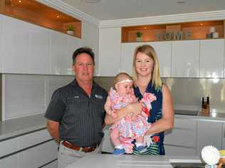 IMPRESSIVE: Award-winning builder Craig Price from Coastal Homes and client Kaitlin Heaney with Aylish Heaney, aged four months. Picture: Caroline Tung