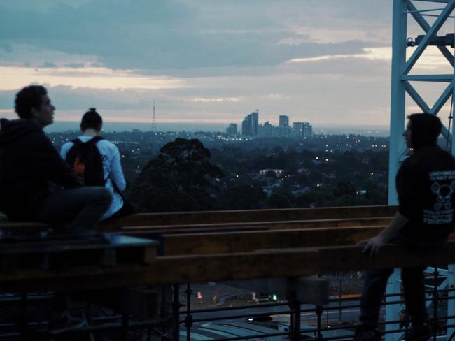 The young men on the roof of the hospital site. Picture: Alfie Nevin