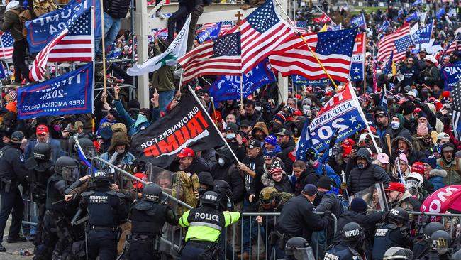 Trump supporters battle with police and security forces as they storm the US Capitol building in Washington, DC on January 6, 2021. Picture: ROBERTO SCHMIDT/AFP)