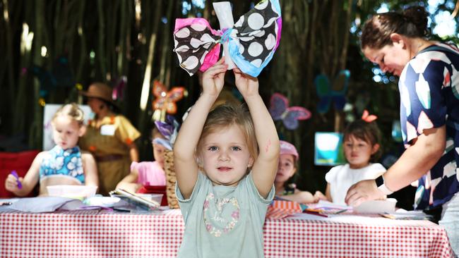 Rosie Johnson, 4, makes a butterfly from tissue paper and pipe cleaners at the Butterfly Station, part of the final day of the Cairns Children's Festival, held at the Tanks Arts Centre, Edge Hill. Picture: Brendan Radke
