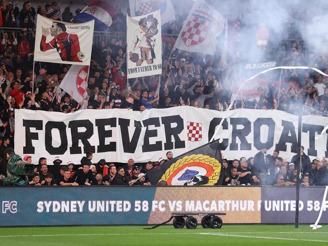 SYDNEY, AUSTRALIA - OCTOBER 01: Sydney United fans enjoy the atmosphere during the Australia Cup Final match between Sydney United 58 FC and Macarthur FC at Allianz Stadium on October 01, 2022 in Sydney, Australia. (Photo by Cameron Spencer/Getty Images)