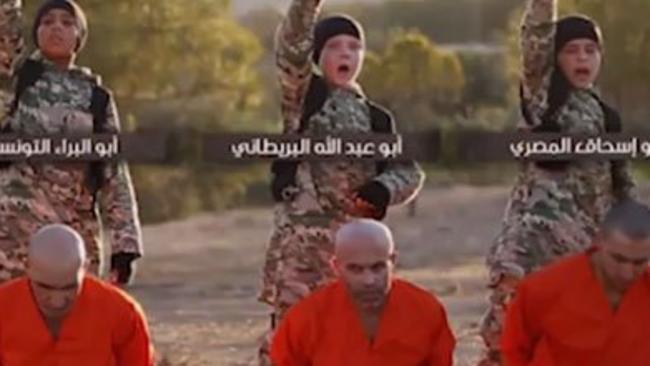 The boy and four others are shown executing ISIS captives in Raqqah.