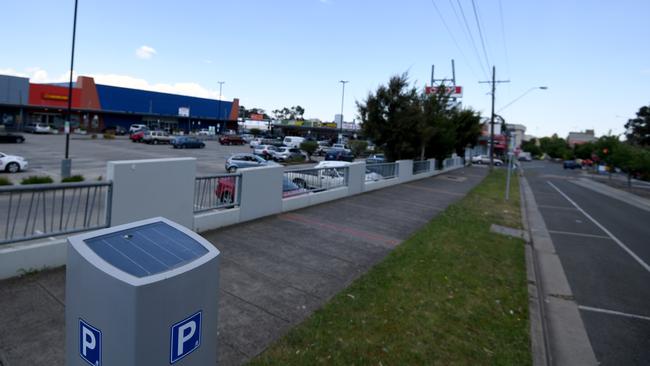 A parking meter on Princes Highway, Dandenong, with the free — and nearly empty — Coles carpark in the background. Picture: Penny Stephens