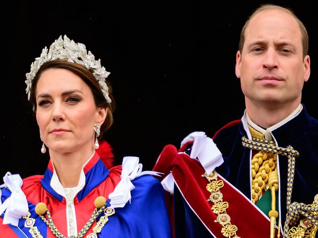 TOPSHOT - Britain's Catherine, Princess of Wales (L) and Britain's Prince William, Prince of Wales stand on the Buckingham Palace balcony, in London, following the coronations of King Charles III and Queen Camilla, on May 6, 2023. - The set-piece coronation is the first in Britain in 70 years, and only the second in history to be televised. Charles will be the 40th reigning monarch to be crowned at the central London church since King William I in 1066. Outside the UK, he is also king of 14 other Commonwealth countries, including Australia, Canada and New Zealand. Camilla, his second wife, will be crowned queen alongside him, and be known as Queen Camilla after the ceremony. (Photo by Leon Neal / POOL / AFP)