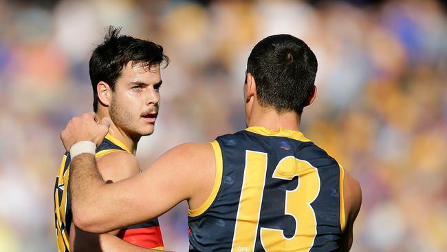 Crows young gun Darcy Fogarty with co-captain Taylor Walker. Picture: Will Russell/AFL Photos via Getty Image