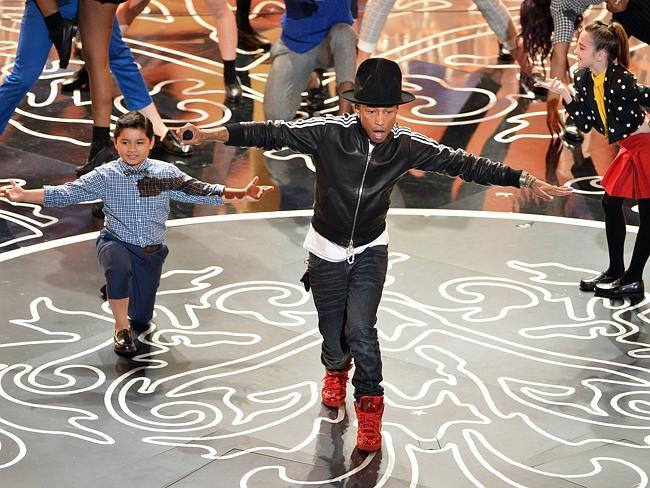 Singer Pharrell Williams performs onstage during the Oscars.