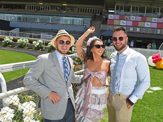 Austin Roth, Elle Polkinghorne and Kyle Williams braved the heat for the Melbourne Cup. Picture: Tom Huntley