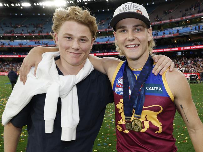 Brothers Levi and Will Ashcroft pose for a photo after the Brisbane Lions premiership win in September. Picture: Michael Klein