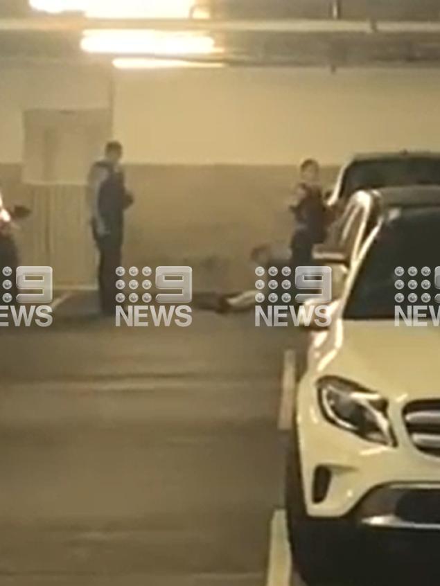 Police opened fire in a carpark after a vehicle allegedly charged at them. Picture: Nine News