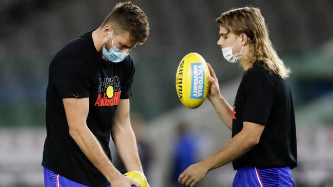 Marcus Bontempelli and Bailey Smith in masks before the Western Bulldogs and the Melbourne Demons match at Marvel Stadium. Picture: Getty