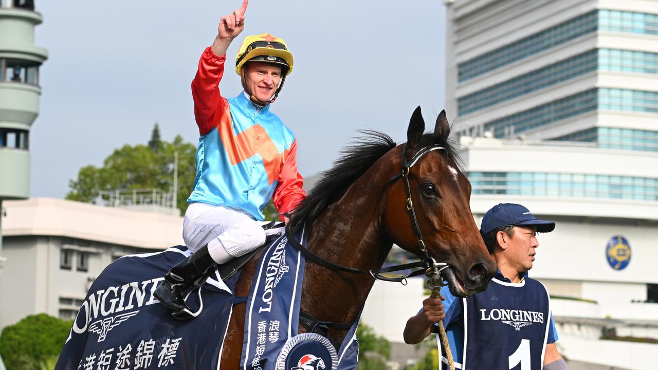 HONG KONG, CHINA - DECEMBER 08: Zac Purton riding Ka Ying Rising after winning Race 5, the Longines Hong Kong Sprint during racing at Sha Tin Racecourse on December 08, 2024 in Hong Kong, China.  (Photo by Vince Caligiuri/Getty Images)