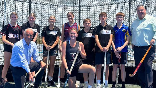 Mackay LNP candidate (front left) and Member for Dawson Andrew Willcox (front right) pose with members of Hockey Mackay after announcing $800,000 in funding for a new indoor facility. Picture: Hockey Mackay Facebook