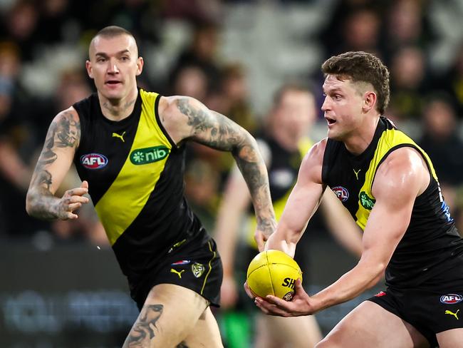 Dustin Martin looks for a handpass from Hopper. Picture: Dylan Burns/AFL Photos via Getty Images