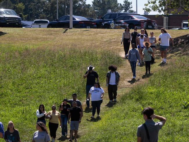 Parents and students leave the scene after being reunited after a shooting took place at Apalachee High School in Winder, Georgia. Picture: AFP