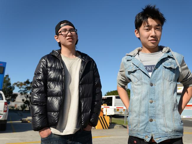 Eiji Tamada (right) and a fellow backpacker the morning after they were rescued from shipping containers and an old bus in the Sydney shanty town.