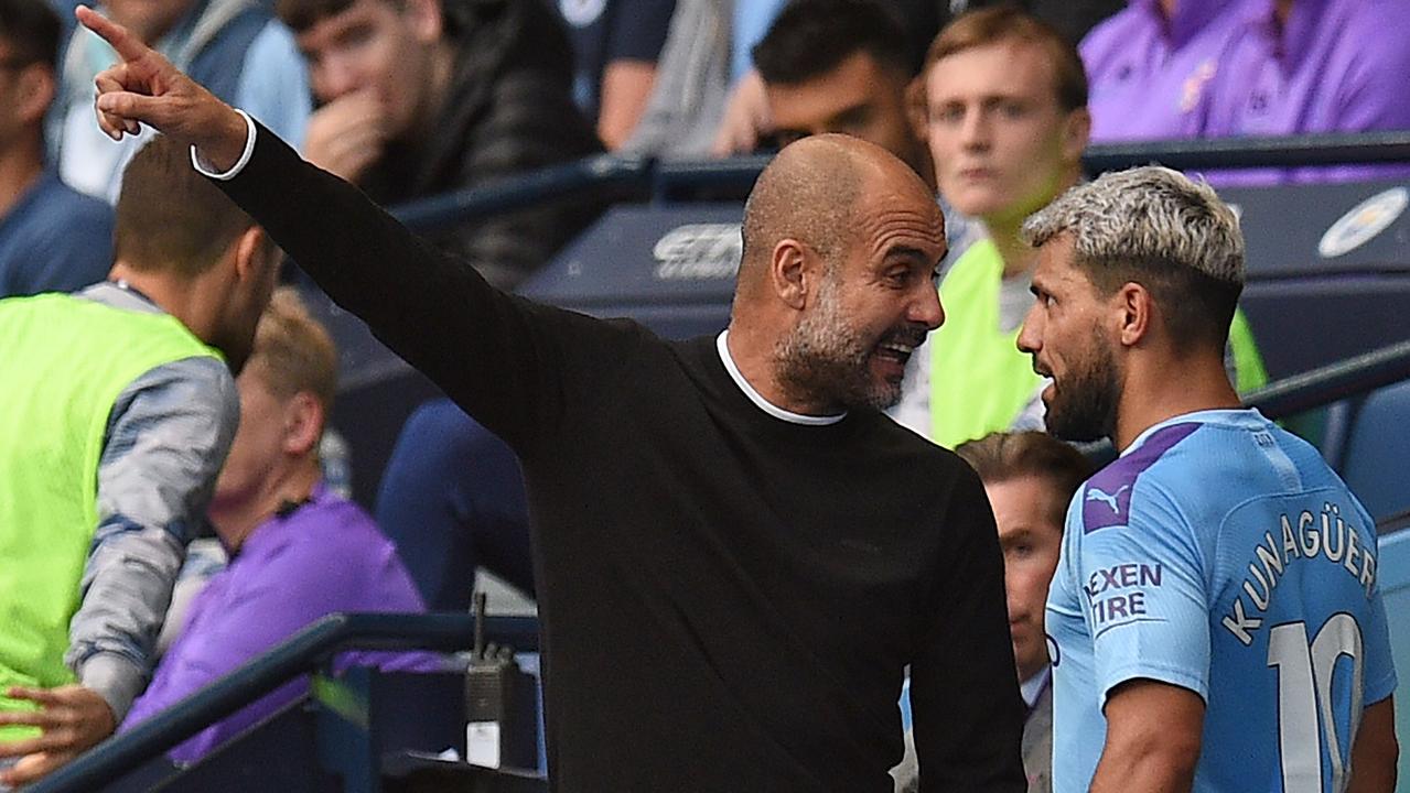 Manchester City coach Pep Guardiola argues with Argentinian striker Sergio Aguero. (Photo by Oli SCARFF / AFP)