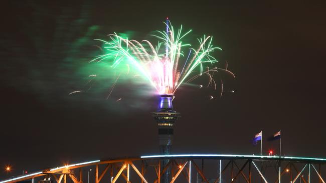 Fireworks explode from the Sky Tower with in Auckland. Picture: Phil Walter/Getty