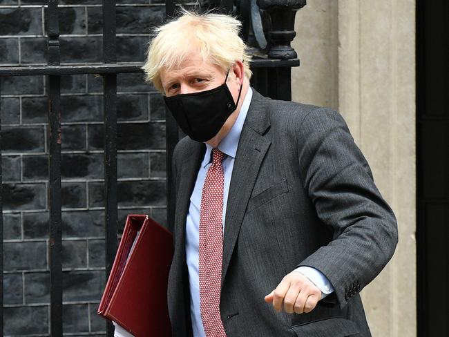 Boris Johnson wears a face mask after leaving Downing Street last week. Picture: Getty Images