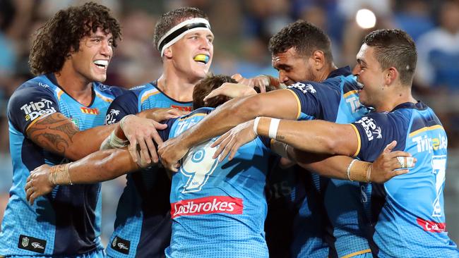 Tyrone Roberts celebrates a try with his Titans teammates. Picture: Richard Gosling