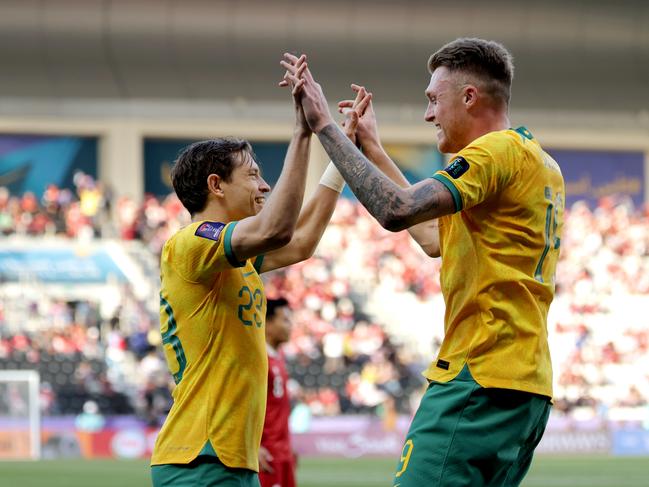 Craig Goodwin (right) and Harry Souttar have a ‘good connection’. Picture: Lintao Zhang/Getty Images