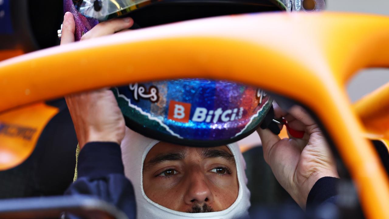 ABU DHABI, UNITED ARAB EMIRATES - DECEMBER 14: Daniel Ricciardo of Australia and McLaren F1 prepares to drive in the garage during Formula 1 testing at Yas Marina Circuit on December 14, 2021 in Abu Dhabi, United Arab Emirates. (Photo by Clive Rose/Getty Images)