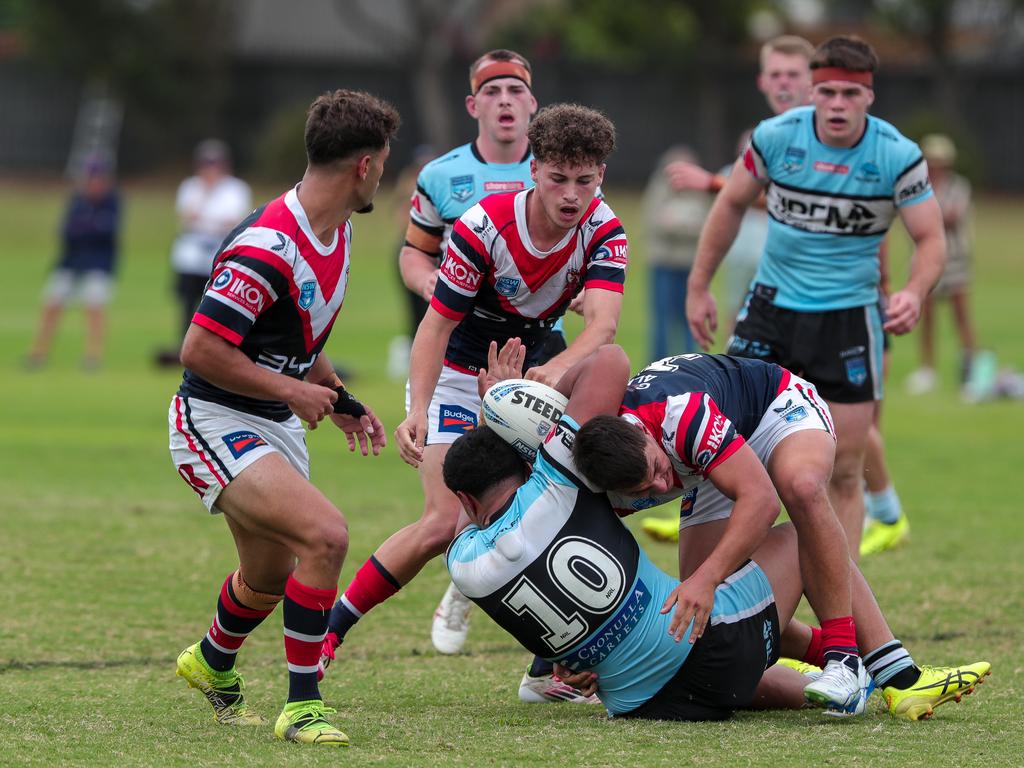 Hudsyn Frost tackled as Tyson Walker looks on. Picture: Adam Wrightson Photography