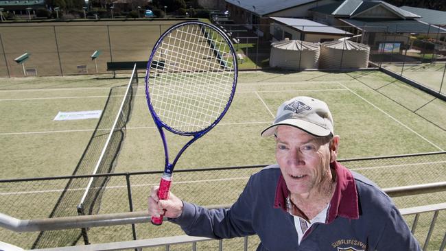 GAME ON: Range Tennis Club secretary Tony Brown in front of one of the brand new court surfaces. Photo: Nev Madsen.