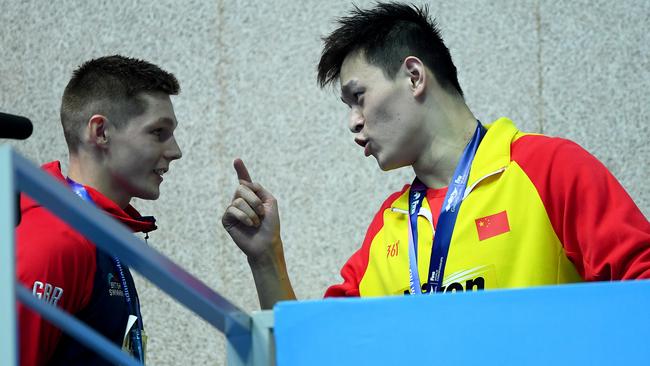 Sun Yang admonishes Duncan Scott for his podium protest.