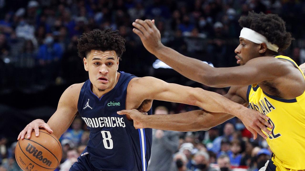 DALLAS, TEXAS - JANUARY 29: Josh Green #8 of the Dallas Mavericks drives the ball past Terry Taylor #32 of the Indiana Pacers in the second half at American Airlines Center on January 29, 2022 in Dallas, Texas. NOTE TO USER: User expressly acknowledges and agrees that, by downloading and or using this photograph, User is consenting to the terms and conditions of the Getty Images License Agreement. Richard Rodriguez/Getty Images/AFP == FOR NEWSPAPERS, INTERNET, TELCOS &amp; TELEVISION USE ONLY ==