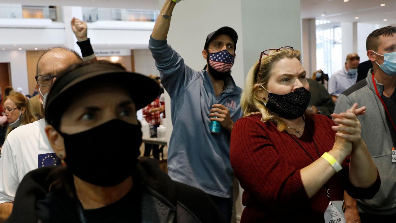 Trump supporters gesture and chant slogans outside the room where absentee ballots for the 2020 general election are being counted in Detroit, Michigan. Picture: Jeff Kowalsky/AFP