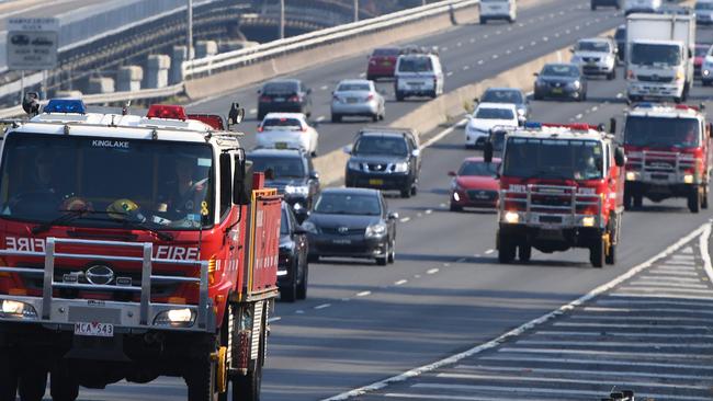 A convoy of Country Fire Authority trucks on their way to fight fires in New South Wales last month. Picture: AAP