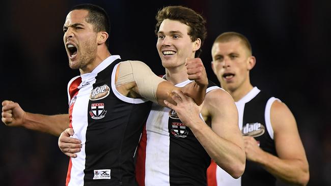 Shane Savage, Blake Acres and Seb Ross celebrate a goal for the Saints. Picture: AAP Images