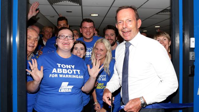 Tony Abbott cutting a ribbon to Brookvale campaign office launch. Picture: Jonathan Ng.